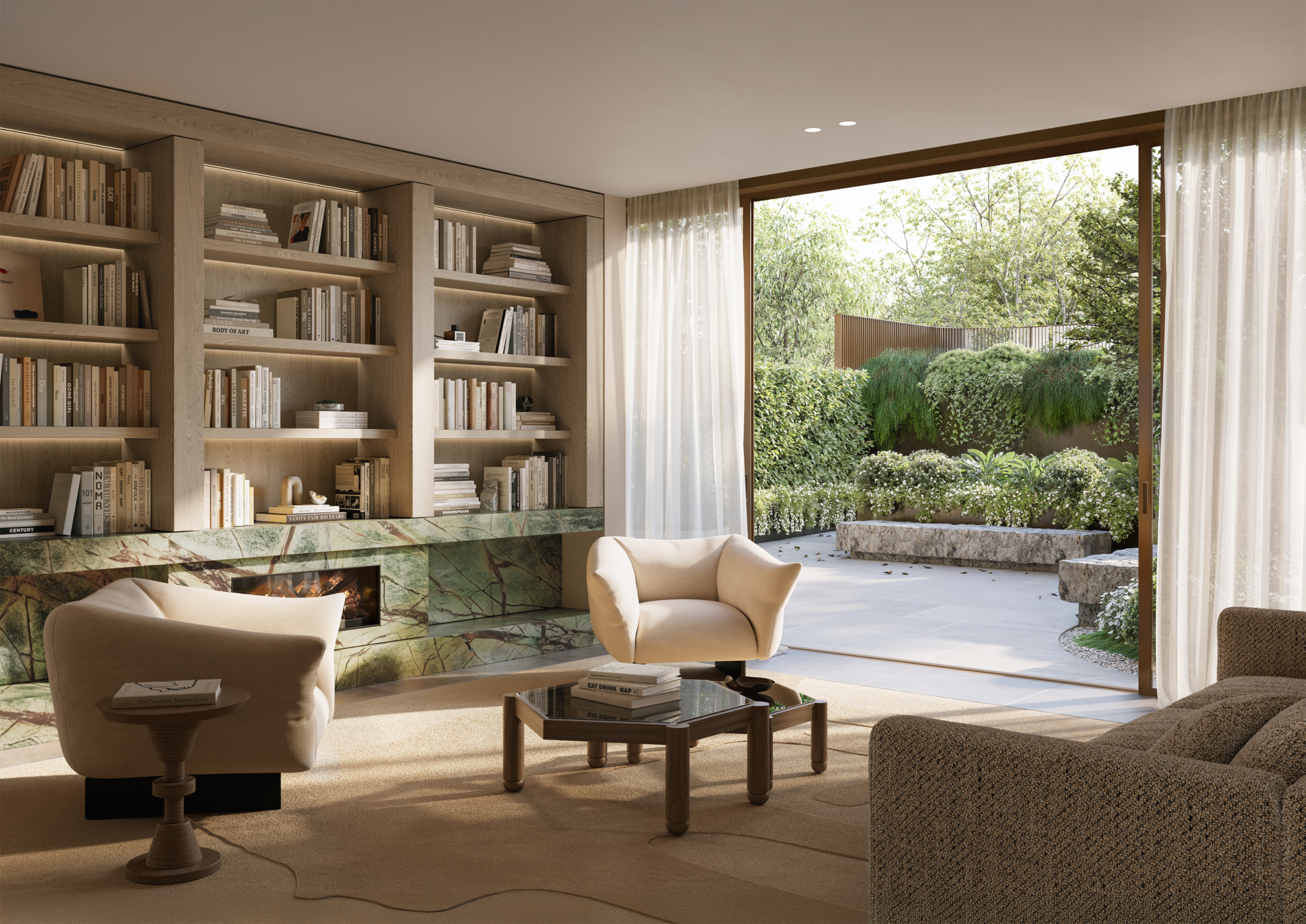 A modern living room with built-in bookshelves, a green marble fireplace, neutral-toned armchairs, and a coffee table. Large glass doors open to a lush garden with trees and stone benches. Natural light fills the space.
